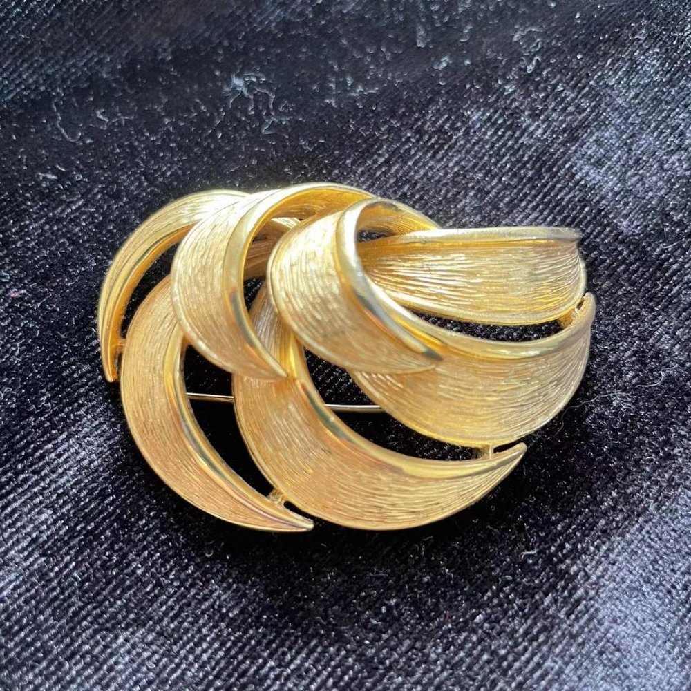 vintage givenchy gold tone brooch stamped